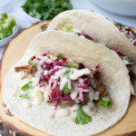 Beer-Braised Beef Tacos with Radicchio Slaw & Horseradish-Cheddar Queso | yestoyolks.com