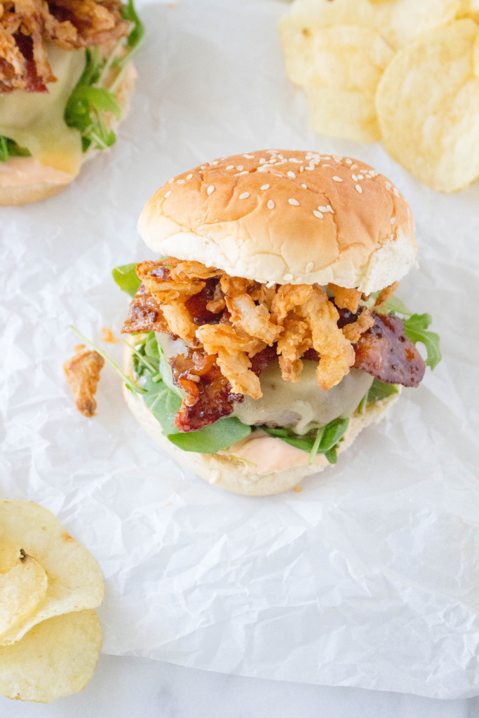 Cheeseburgers with Stout-Glazed Bacon, Crispy Onions, & Sriracha Aioli | yestoyolks.com