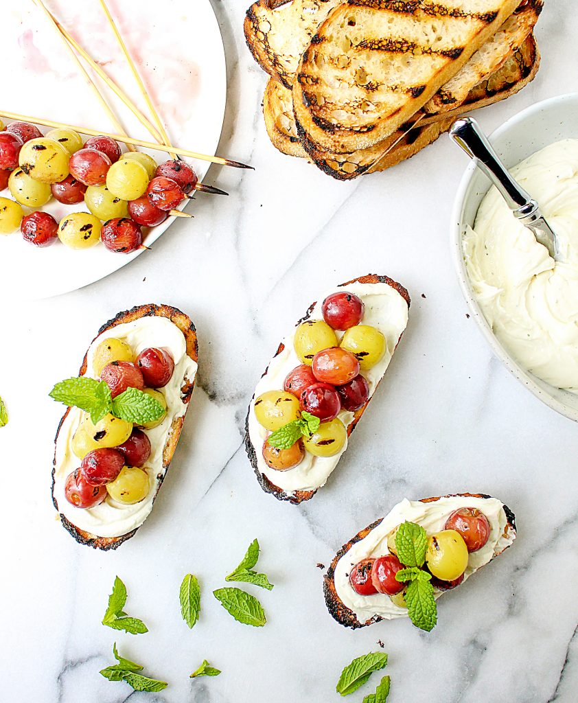 Grilled Grape Crostini with Honeyed Whipped Feta | yestoyolks.com