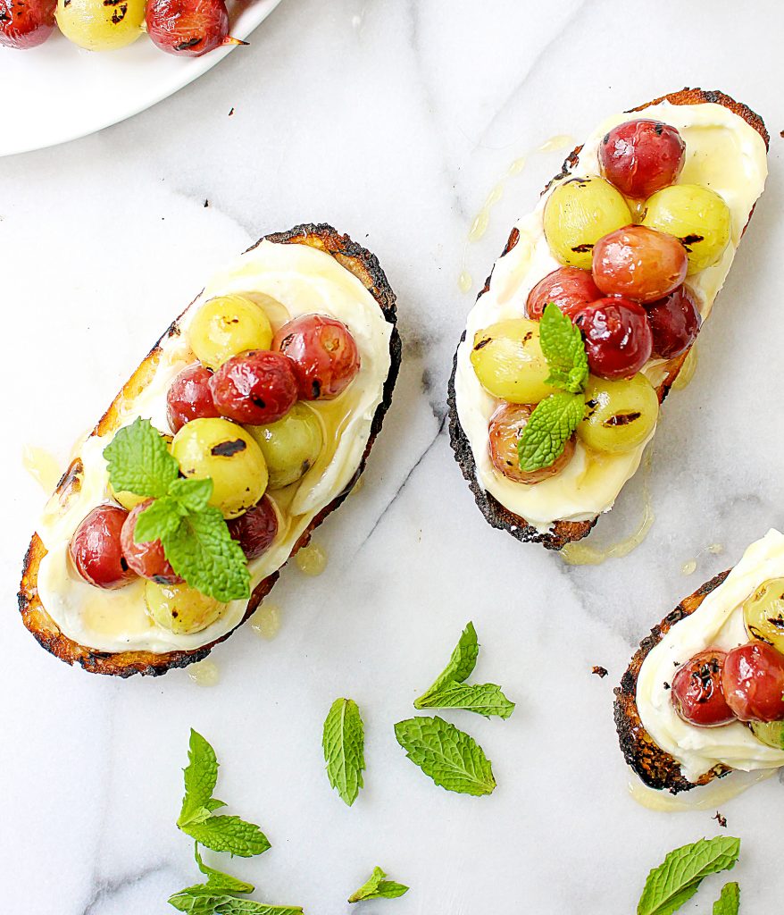 Grilled Grape Crostini with Honeyed Whipped Feta | yestoyolks.com