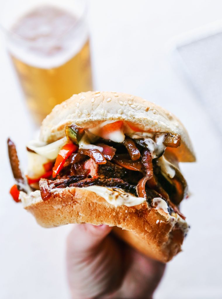 Guinness-Marinated Steak Sandwiches with Peppers, Onions, & Mustard Aioli