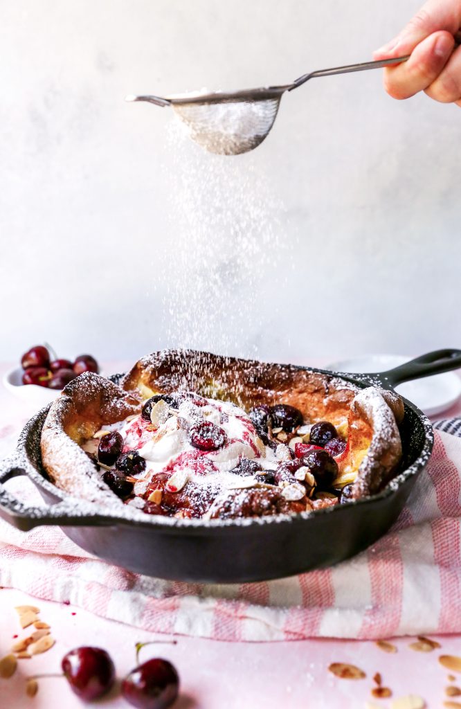 Roasted Cherry Dutch Baby with Amaretto Whipped Cream