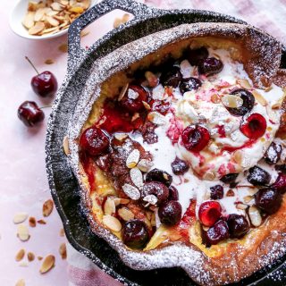 Roasted Cherry Dutch Baby with Amaretto Whipped Cream