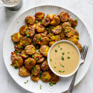 Crispy Smashed Potatoes with Stout Cheddar Sauce